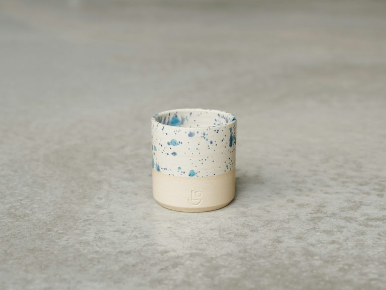 A small blue-and-white Japanese soba choko cup