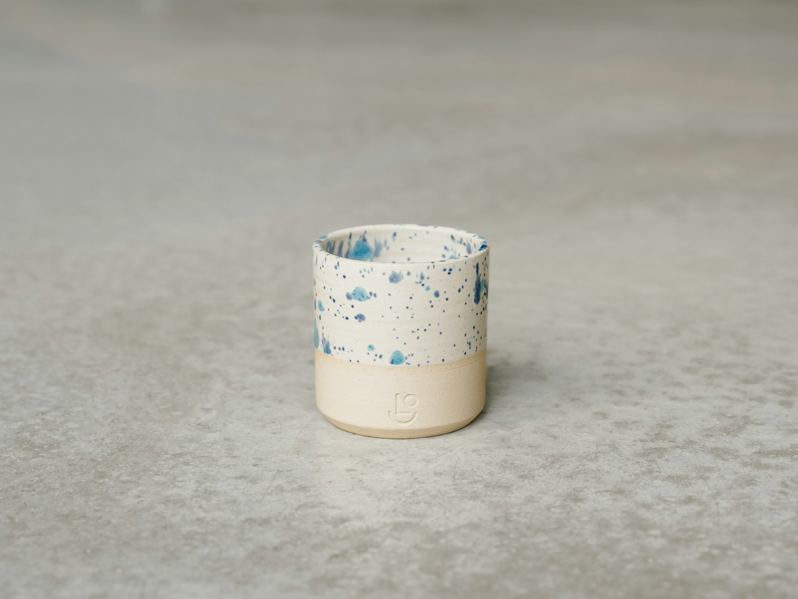 A small blue-and-white Japanese soba choko cup