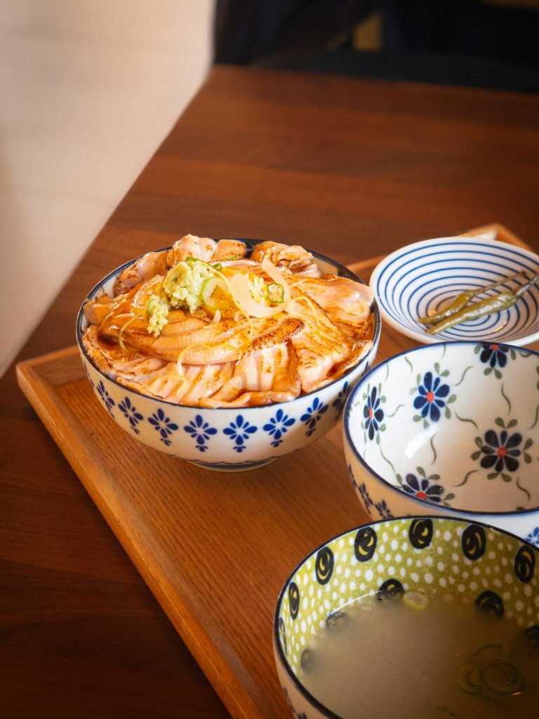 A Japanese donburi rice bowl topped with grilled meat