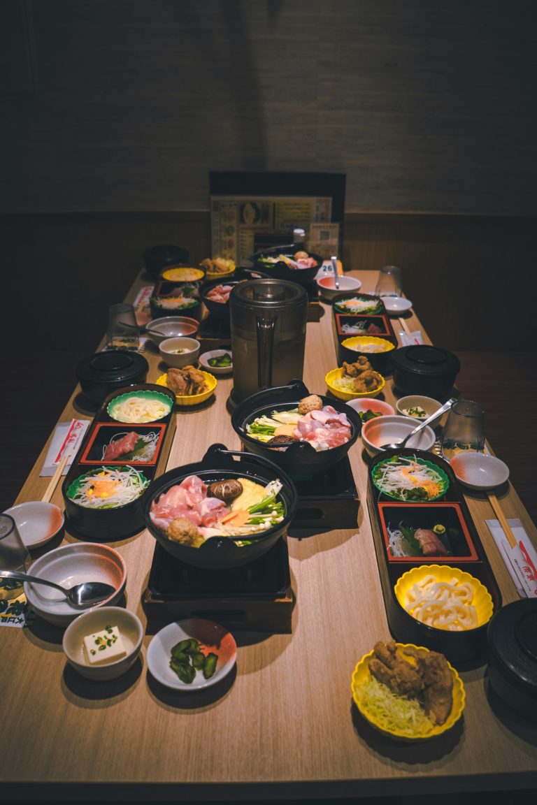 A Japanese table set with many small dishes